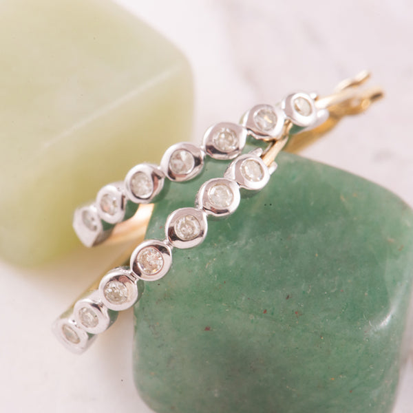 Yellow and White Gold Hoop Earrings Featuring Bezel set Diamonds