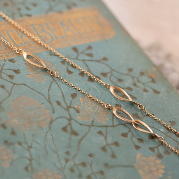 9K Yellow Gold curved open link on trace necklace