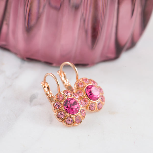 Pink crystal earringsin a daisy style setting with rose gold plating