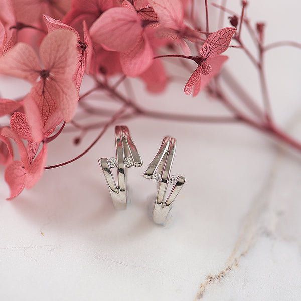 9K WG huggie earrings with Diamonds