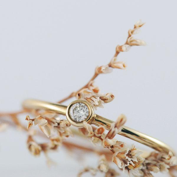 Delicate 9k Yellow Gold Bezel set Diamond ring