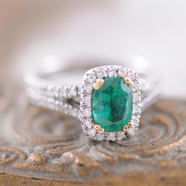 Emerald and Diamond Halo Ring in White Gold