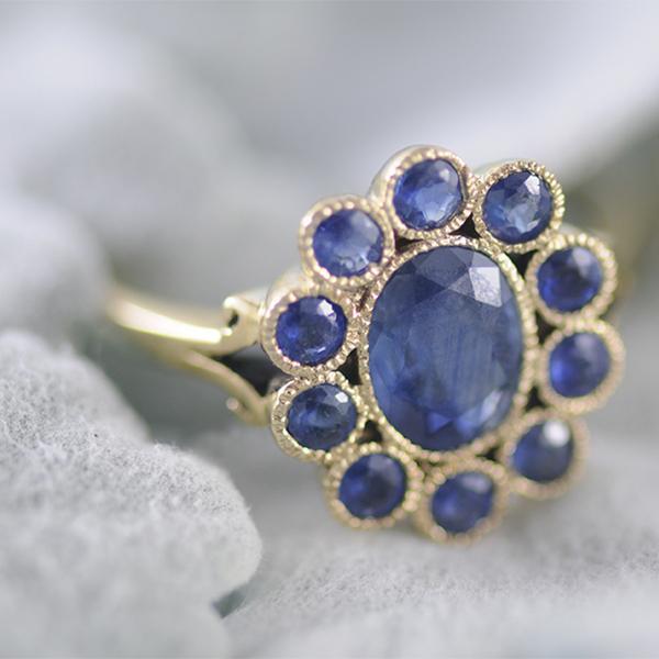 Sapphire Halo Ring Bezel Set in 9k Yellow Gold